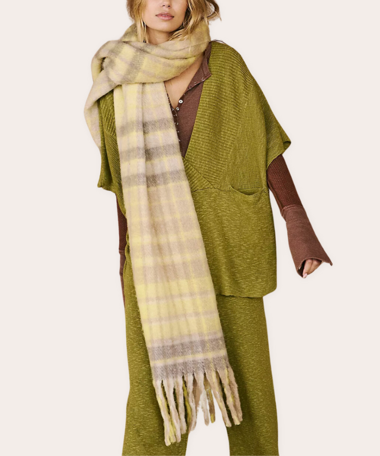 A large, multi-colored plaid wool wrap scarf.