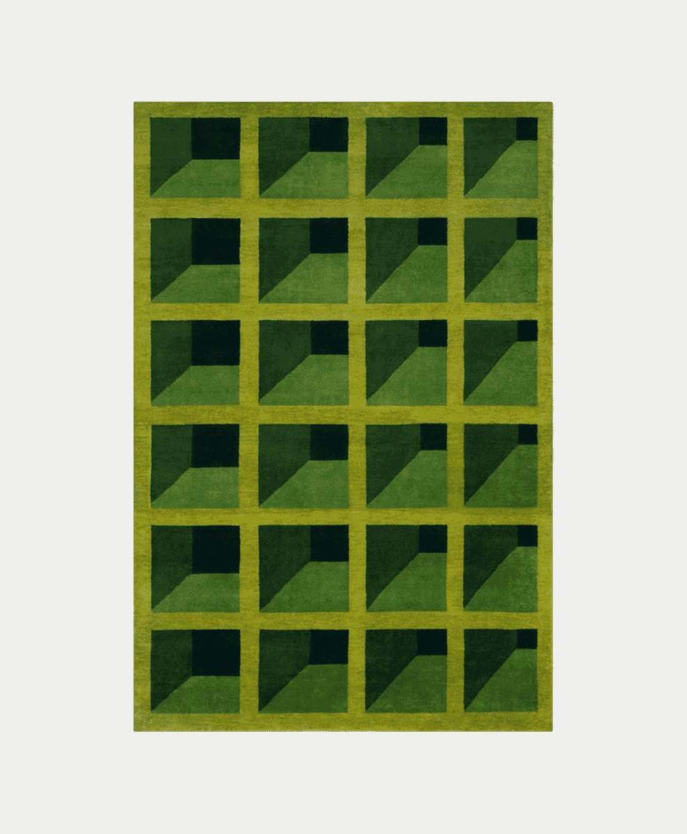 A modern geometric rug with a 3D grid pattern in shades of green and dark grey.