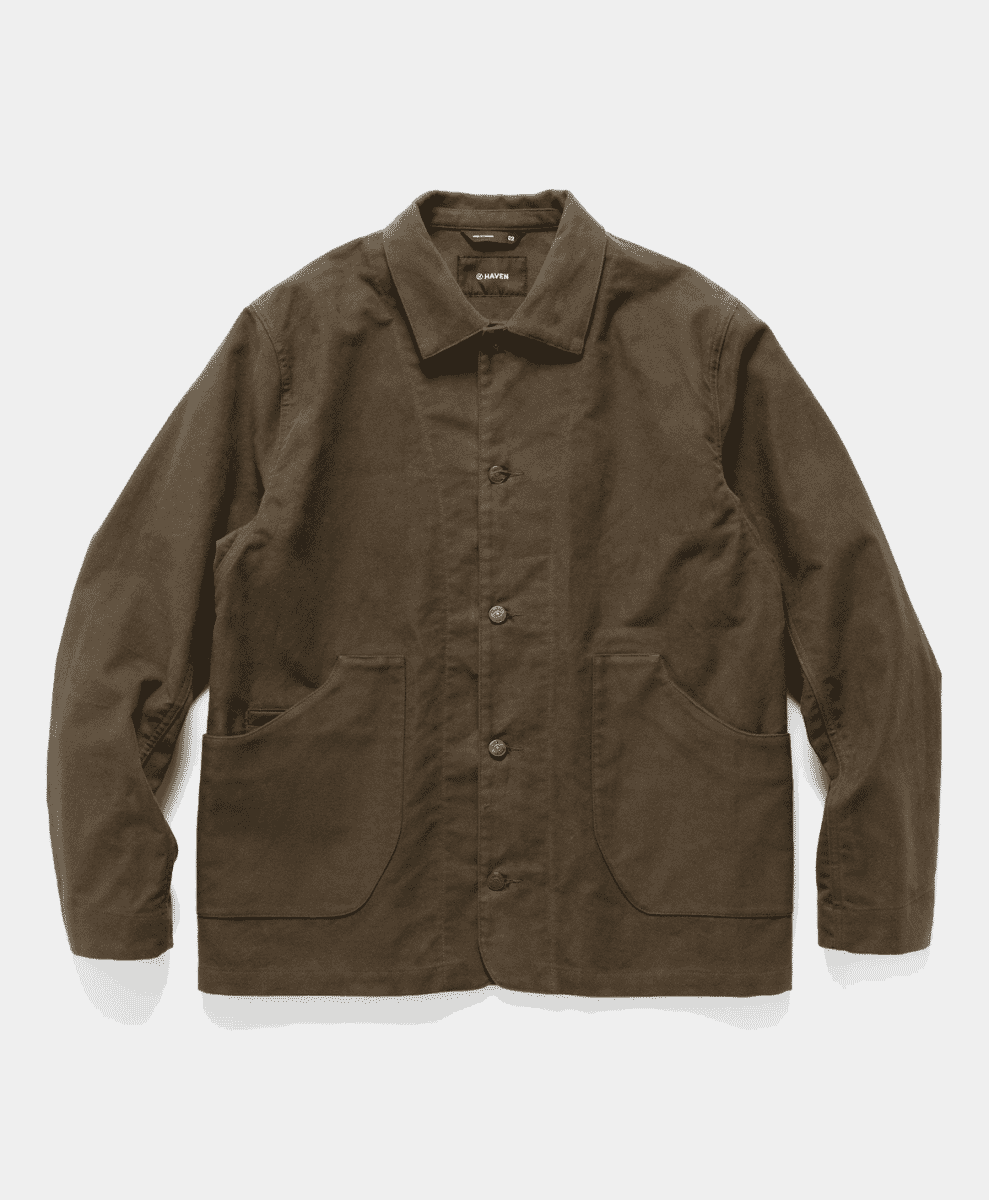 A brown organic cotton moleskin coat with button closures.