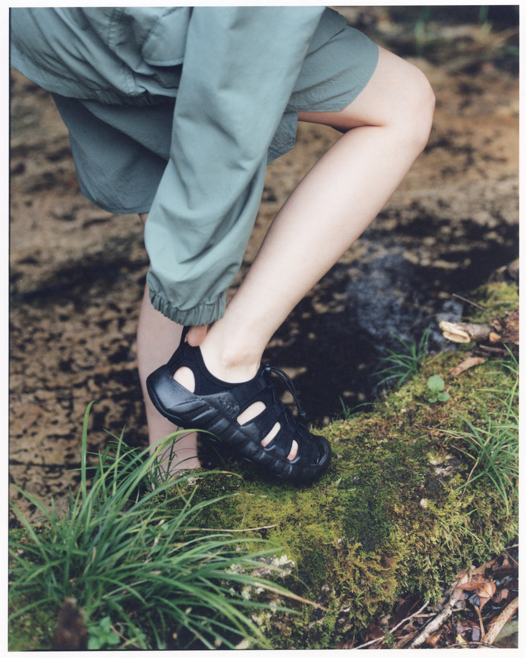 Family-oriented campaign shot featuring different generations wearing the Snow Peak x KEEN 2026 collection.
