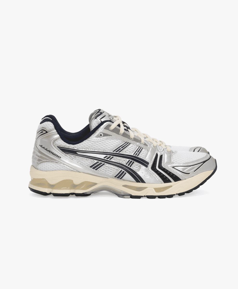 Side-profile of the silver and black JJJJound x ASICS shoe with a vintage cream midsole.
