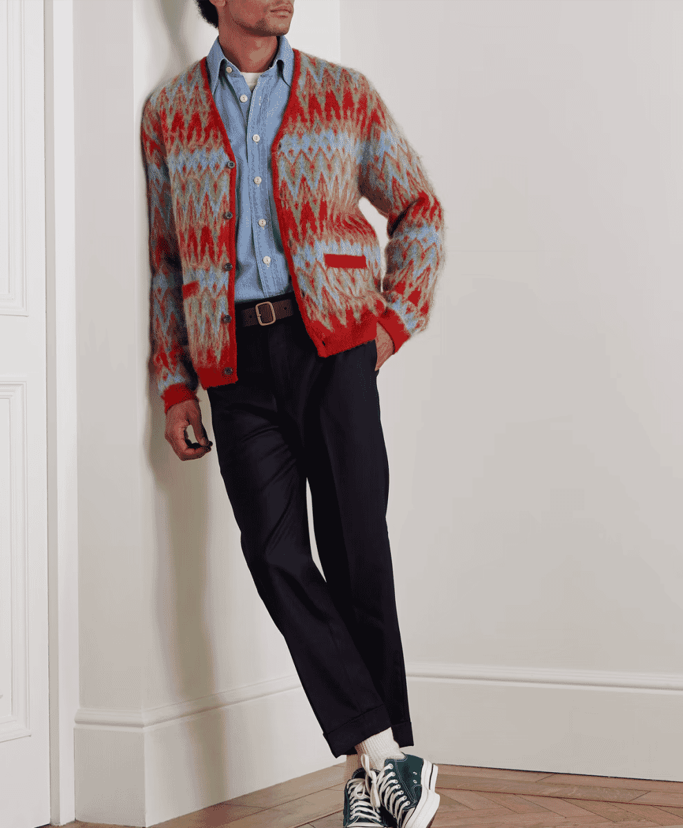 A man in a vibrant red and blue patterned jacquard cardigan by BEAMS PLUS.