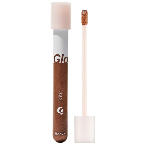 Glossier Lidstar tube with a shimmering liquid eyeshadow formula.