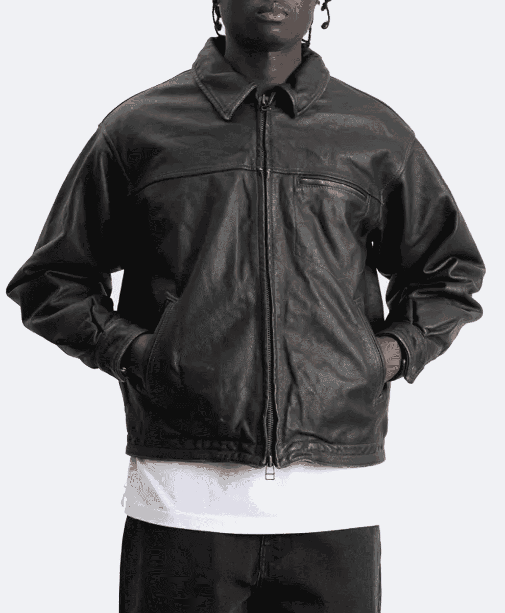 Model wearing a dark brown leather bomber jacket over a white t-shirt.