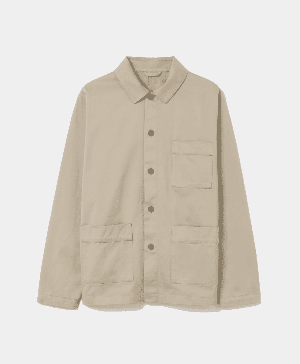 Flat lay of a beige button-up overshirt with four patch pockets
