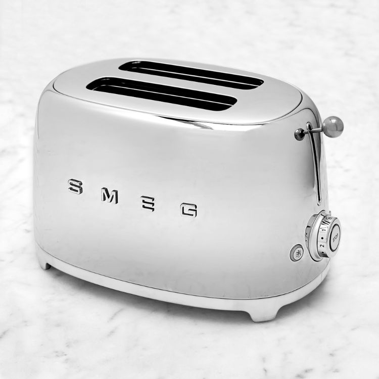 A cream-colored retro-style SMEG toaster.