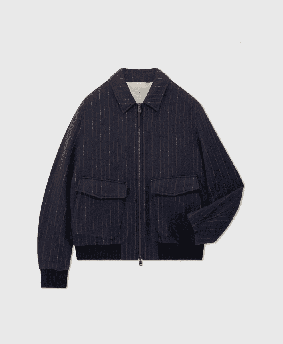 Flat lay of a dark navy pinstripe bomber jacket with ribbed cuffs and flap pockets.