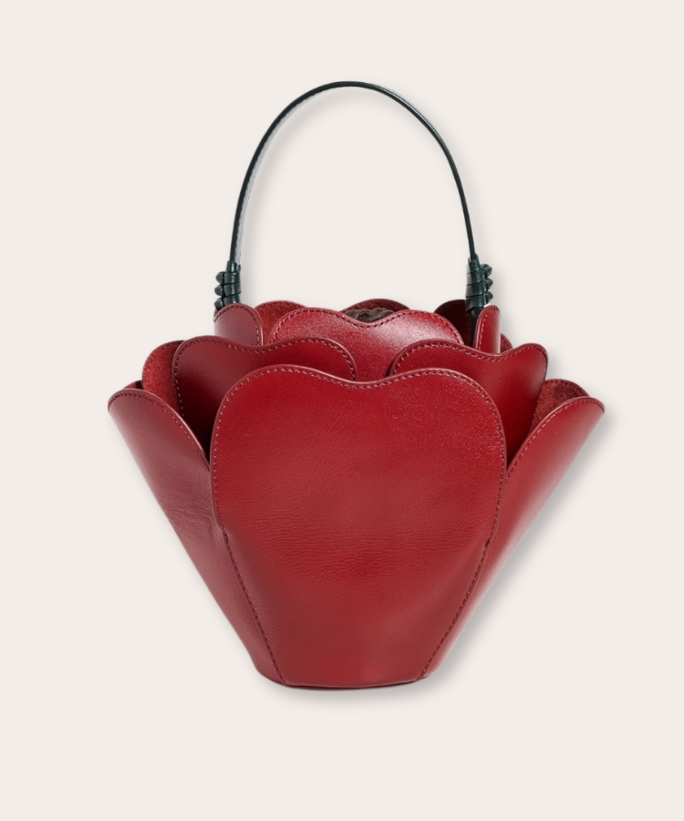 Handbag shaped like a blooming red rose.