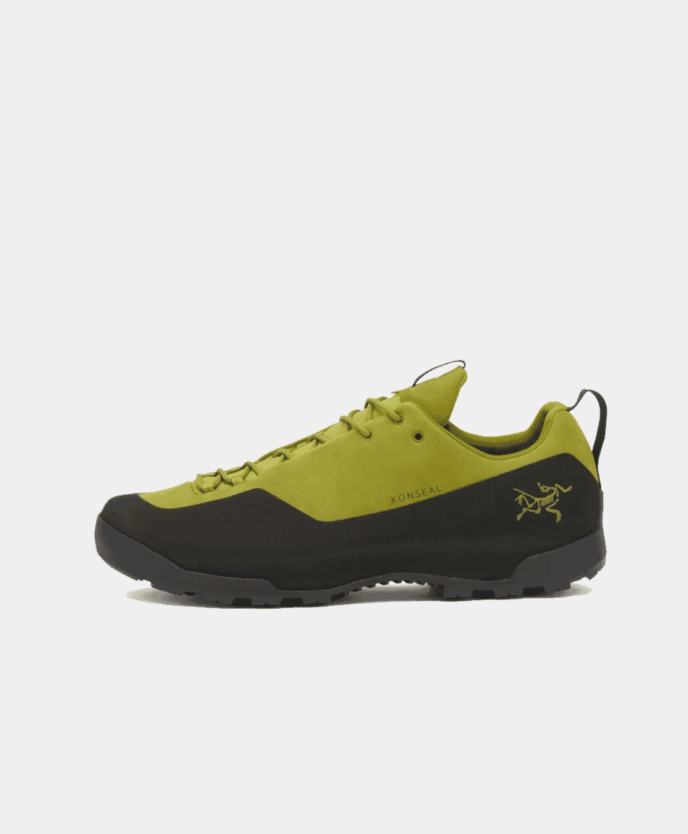 Side view of an Arc'teryx Konseal hiking shoe in olive green and black.
