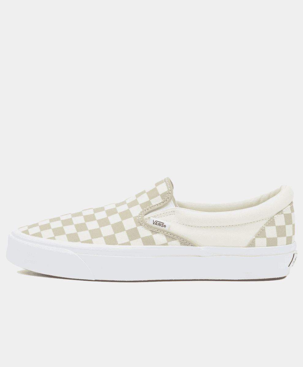 Side-profile of a Vans checkerboard slip-on sneaker in beige and white.
