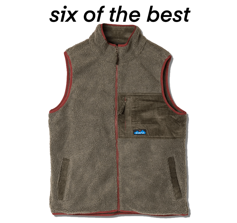 Brown fleece vest with red trim and corduroy accents.