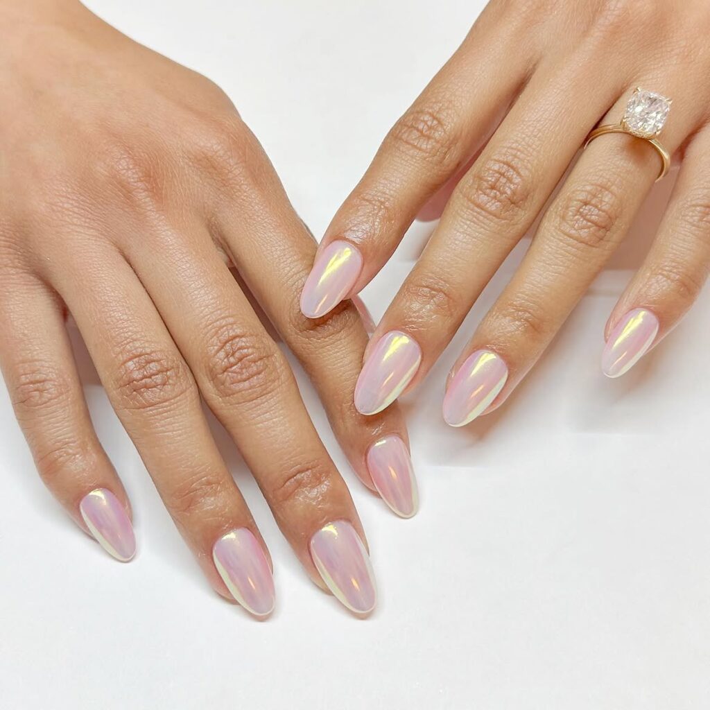 Detailed 3D sculptural nail art with iridescent chrome finish.