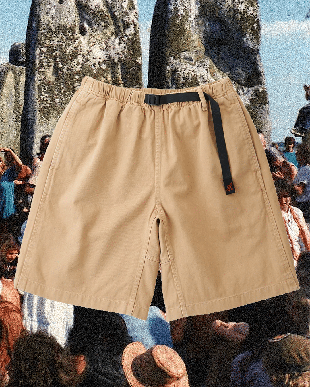 Beige multi-pocket cargo shorts with a black buckled belt, emphasizing utility and security.