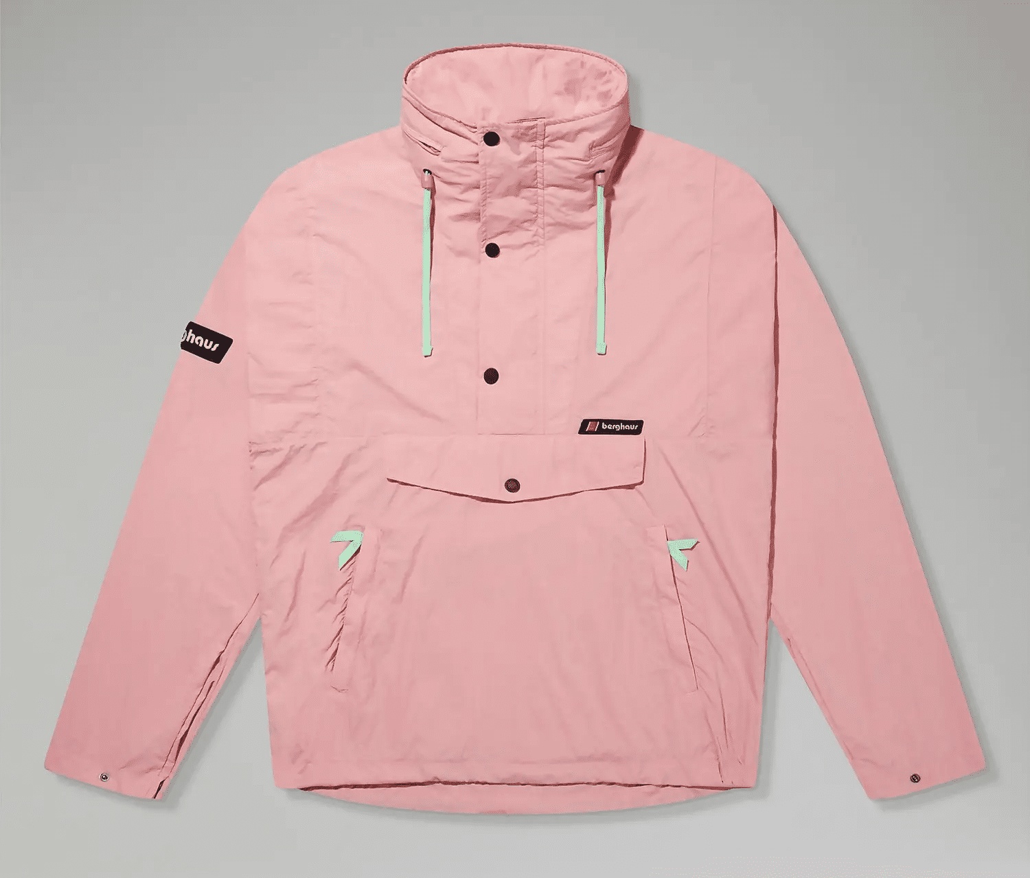 Flat lay of a pink Berghaus windbreaker with mint green details.