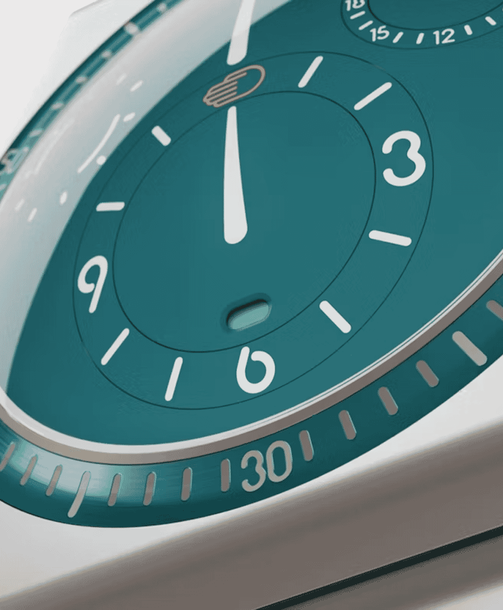Macro close-up of the teal Ressence Type 7 dial featuring white minimalist numerals and oil-filled depth.