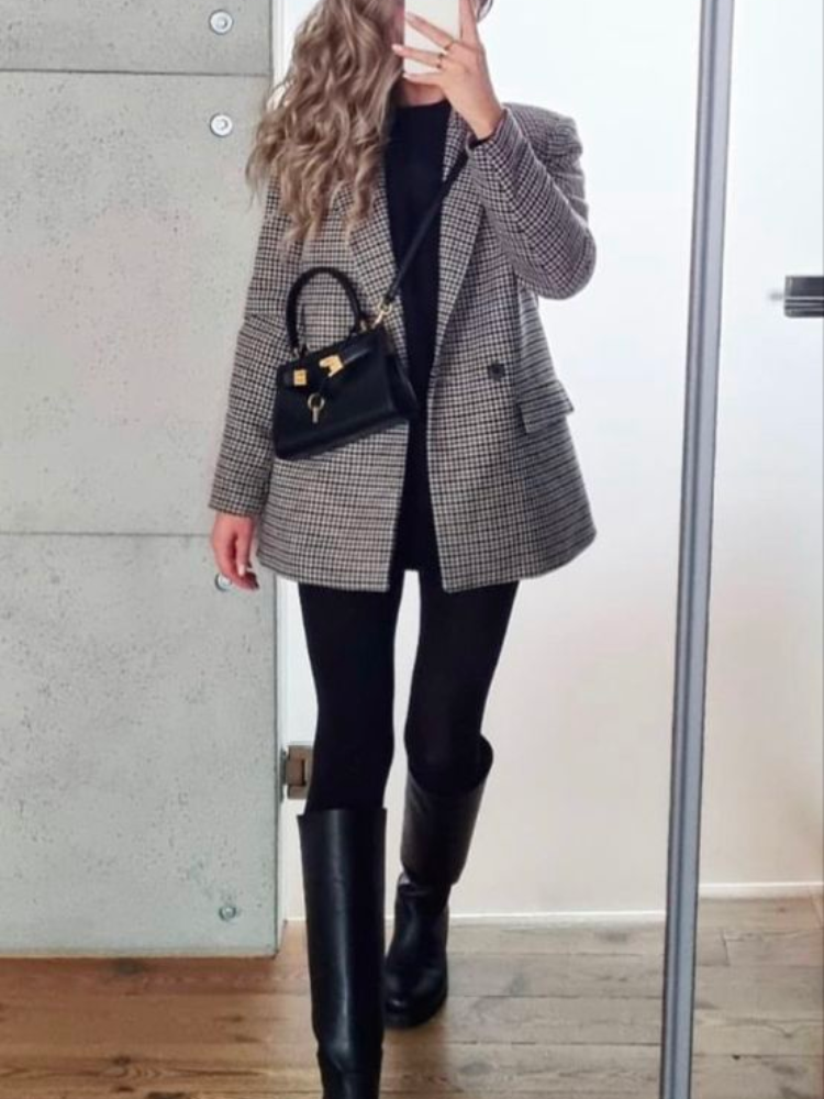 Pinterest inspiration photo of a professional outfit featuring a blazer and boots.