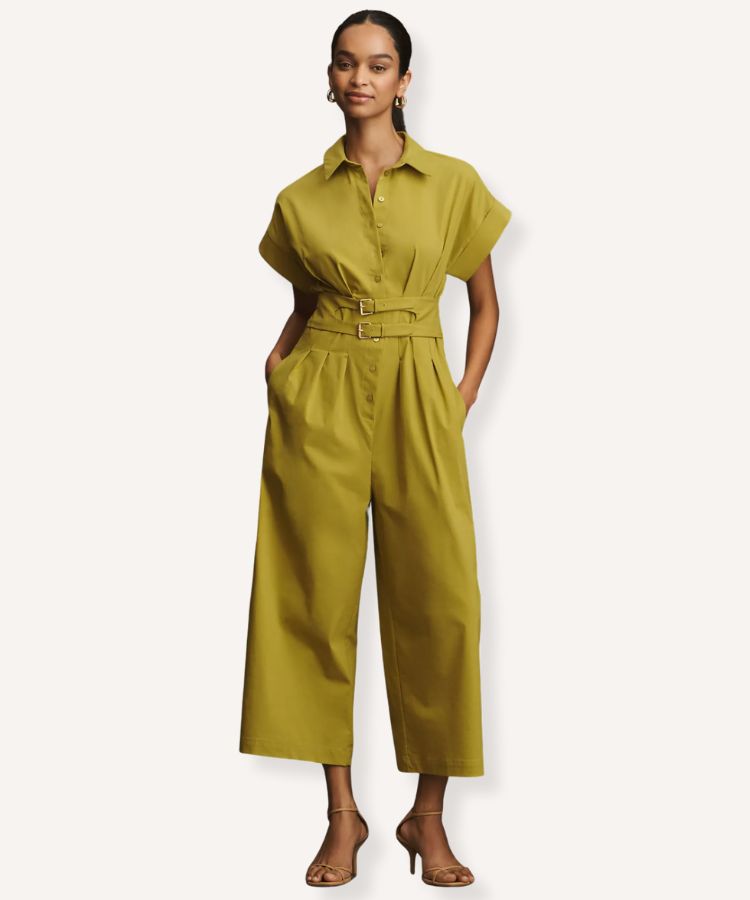 A pleated jumpsuit in chartreuse with a wide-leg silhouette and halter neck.