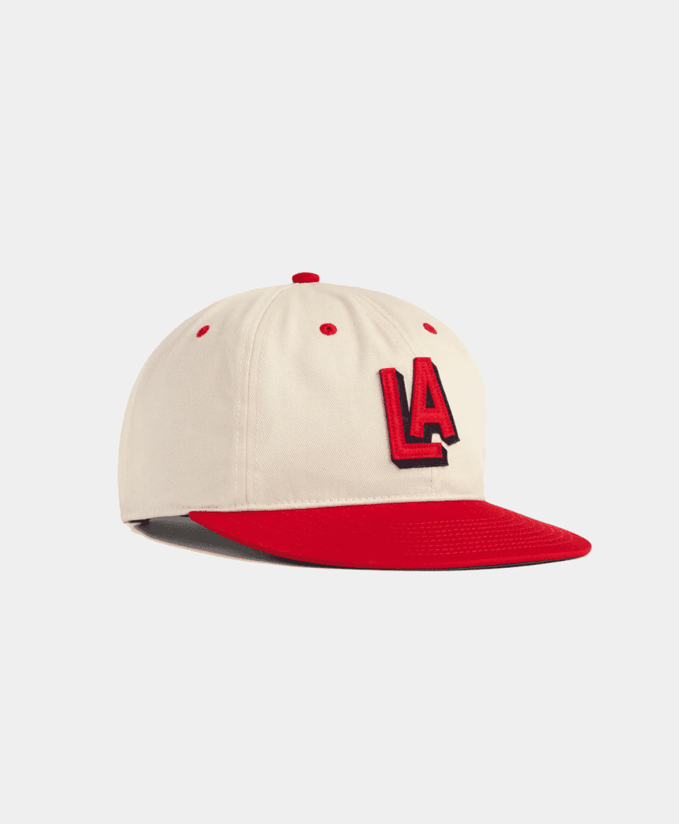 Cream and red LA logo baseball cap.