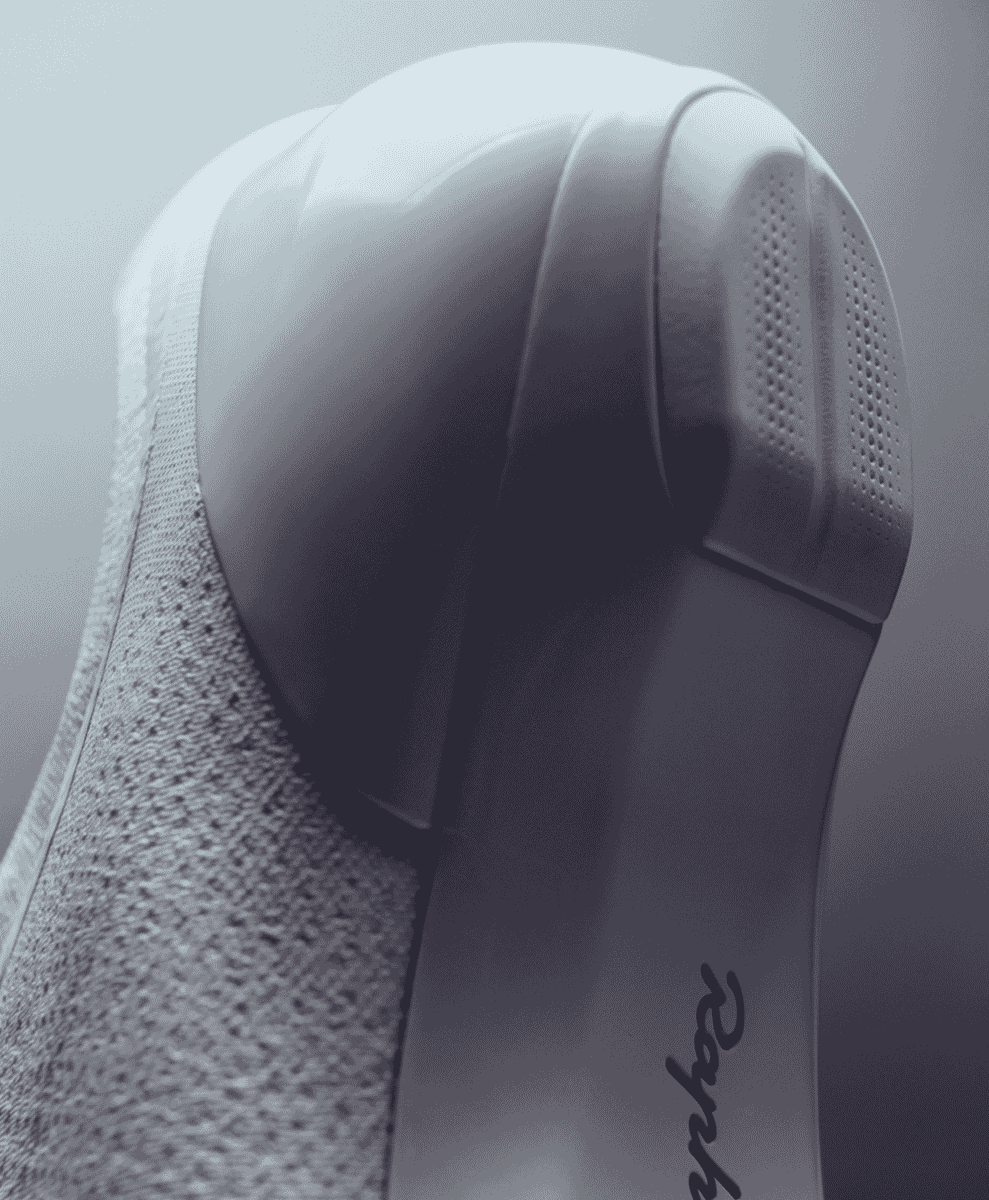 Close-up of the sleek white sole of a Rapha cycling shoe showing the performance grip pattern.