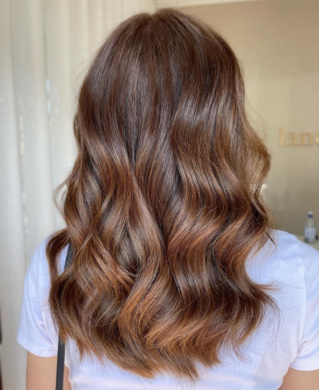 Subtle chocolate copper hair with very fine, natural-looking highlights.