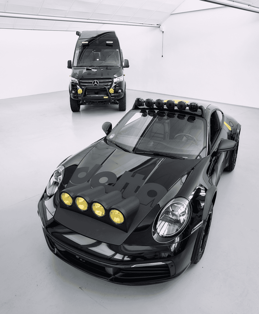 Studio shot of the customized black Porsche 911 and Mercedes Sprinter van parked side-by-side.
