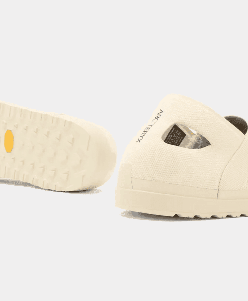 Lateral view of the shoe focusing on its slip-on construction for urban exploration.