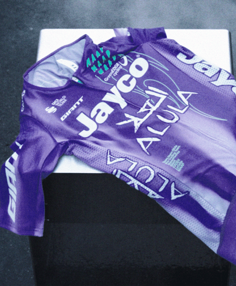 Flat lay of the Jayco Alula 2026 team jersey on a white surface.