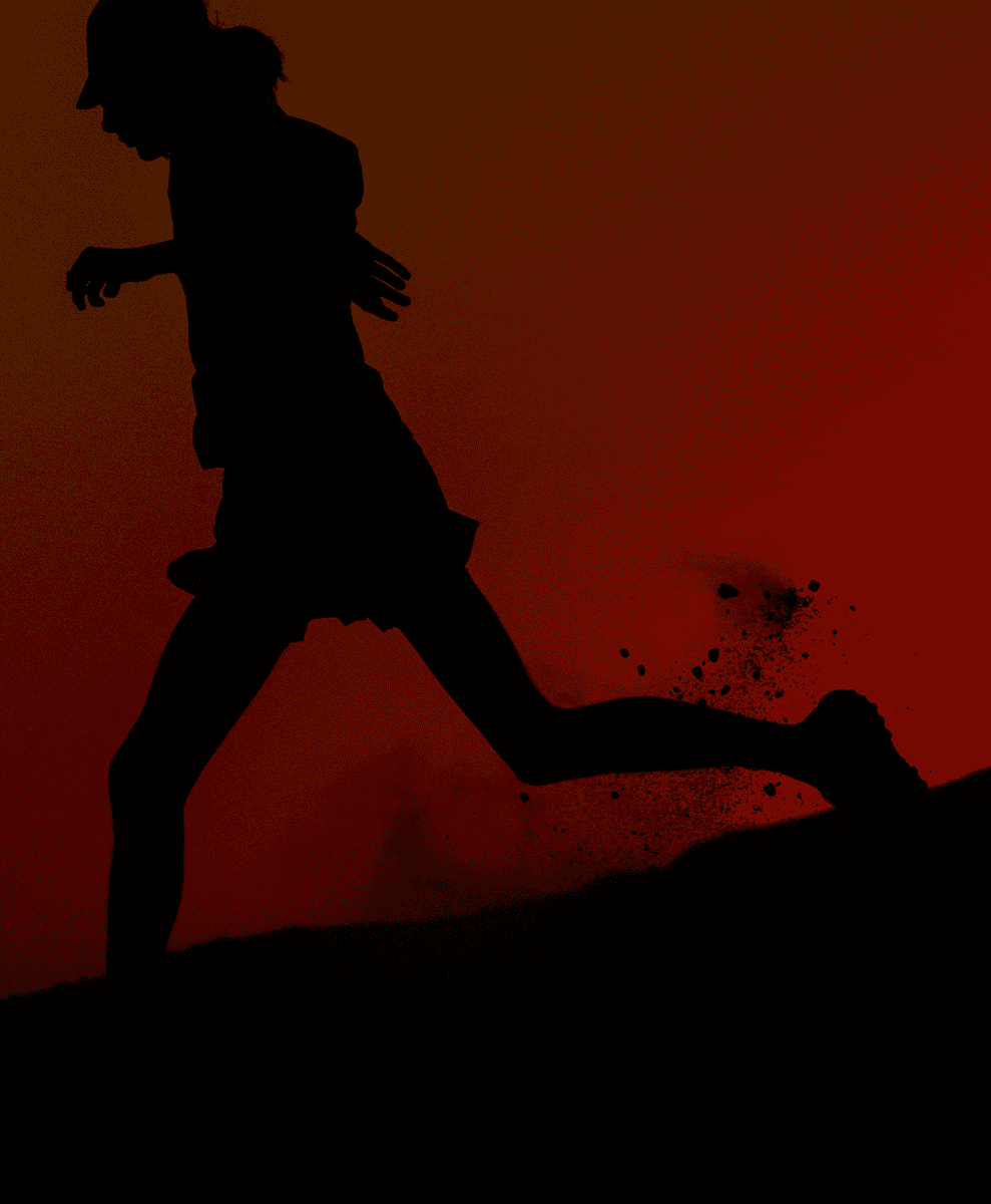 Silhouette of a female runner kicking up dust against a red-orange gradient background.