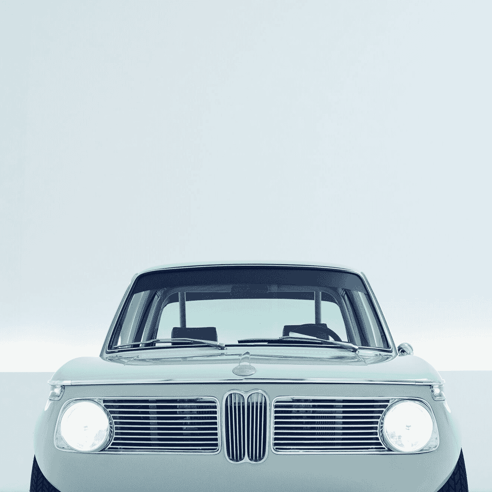 Front view of a classic BMW featuring the signature kidney grille and round headlights.