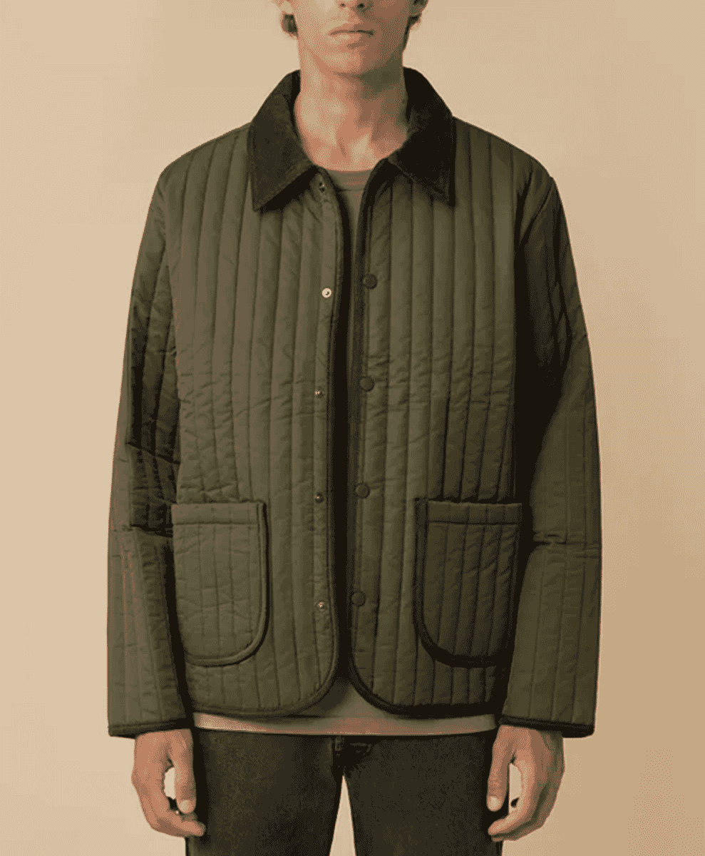 Studio shot of a dark olive green quilted jacket with a corduroy collar and vertical stitching.