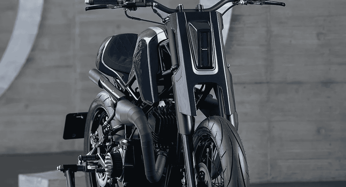 Monochrome industrial shot focusing on the motorcycle's engine and aggressive low-slung stance.