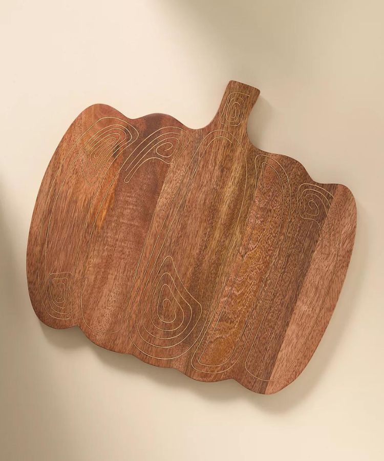 Anthropologie Pumpkin Cheese Board made of wood and marble.