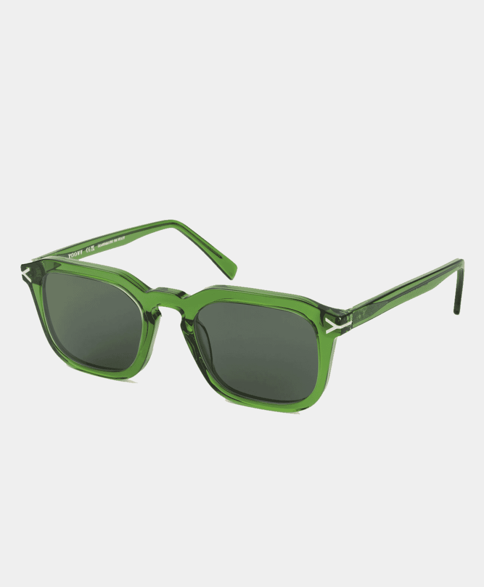 A pair of translucent green rectangular sunglasses on a white background.