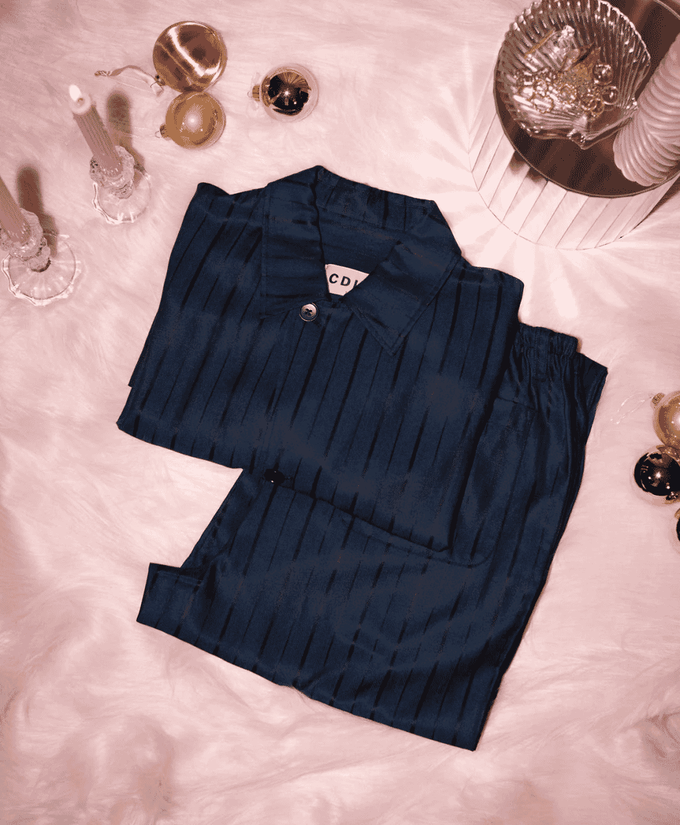 Navy blue pleated pajama set in a festive setting.