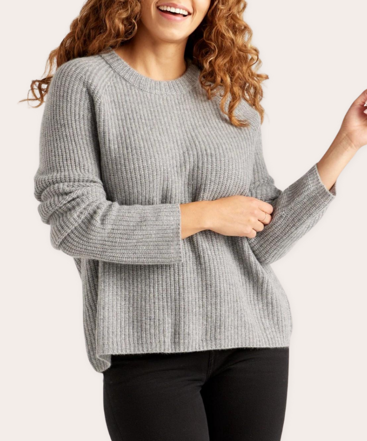 A classic cashmere fisherman style sweater with a ribbed knit pattern.