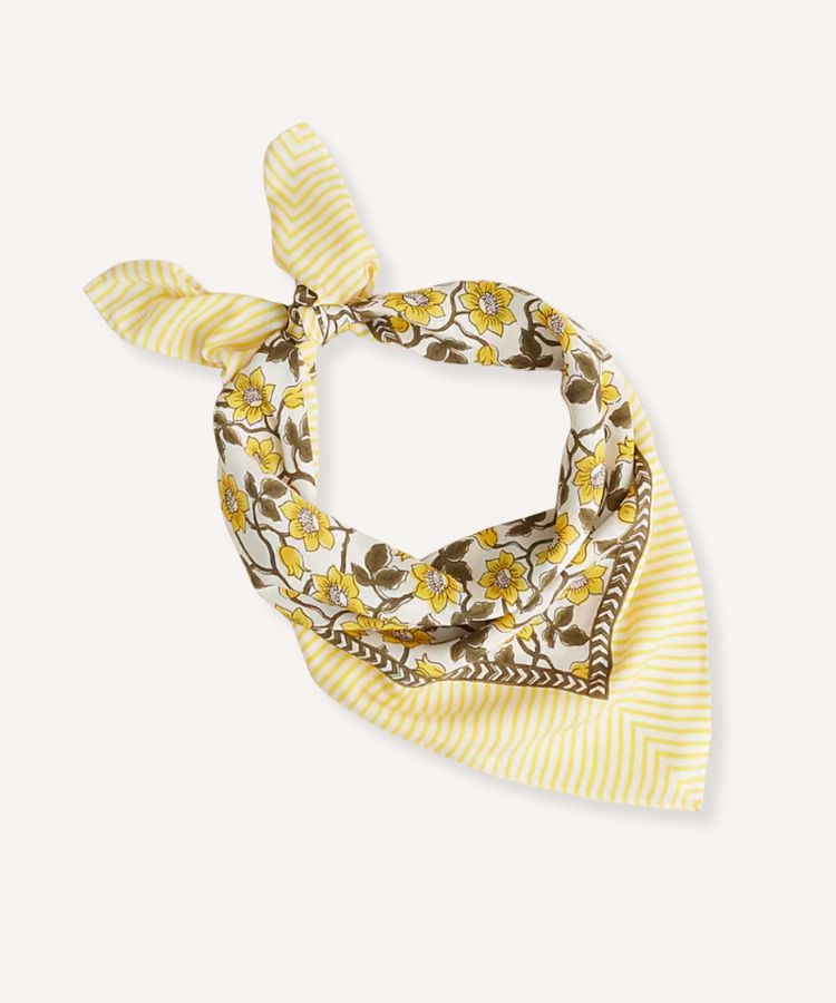 A large silk scarf featuring an intricate, colorful print.