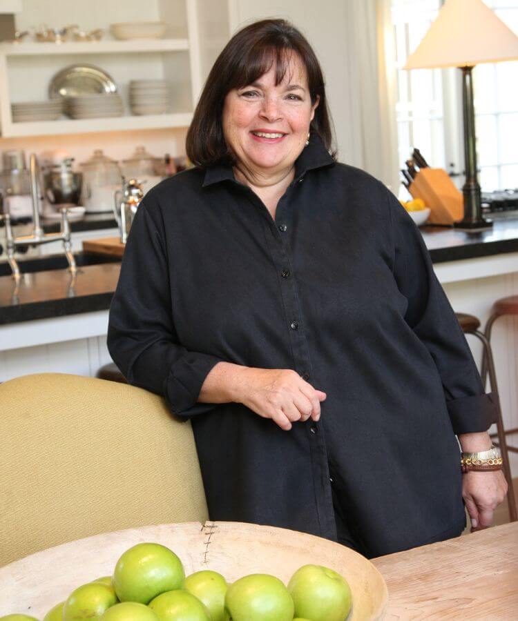 Charli XCX in a white mini dress and sunglasses
