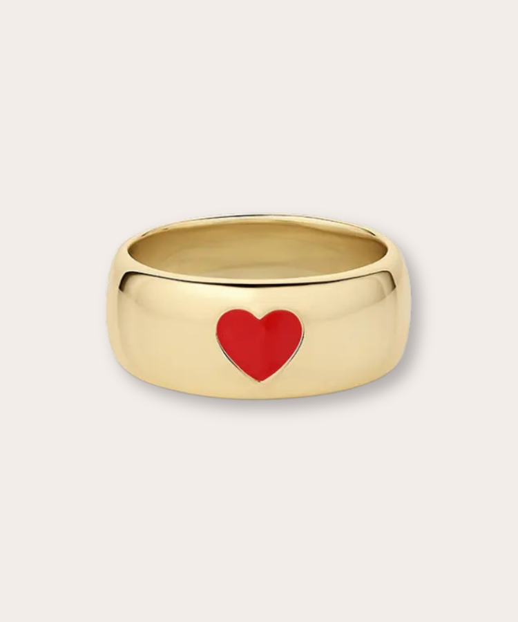 Gold statement ring with a heart-shaped design.