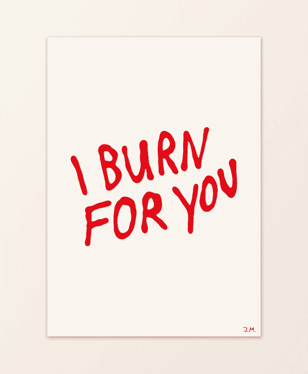 A minimalist art print with handwritten red text reading 'I BURN FOR YOU' on a cream background.
