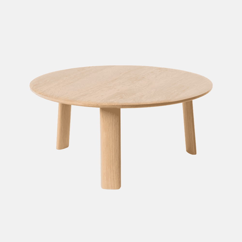 Minimalist round wooden coffee table with three thick cylindrical legs.