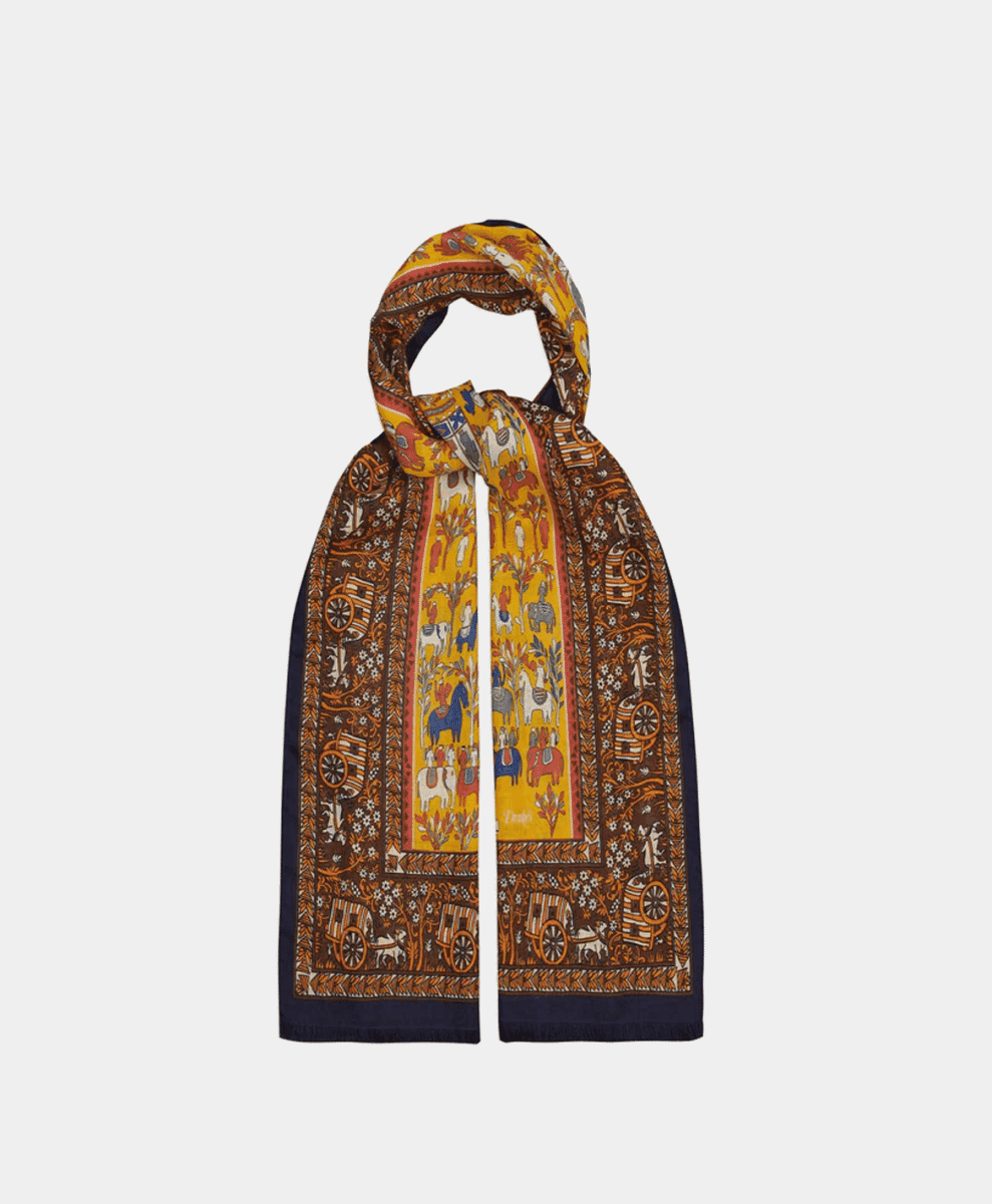 A yellow and brown patterned wool-silk scarf with animal motifs.