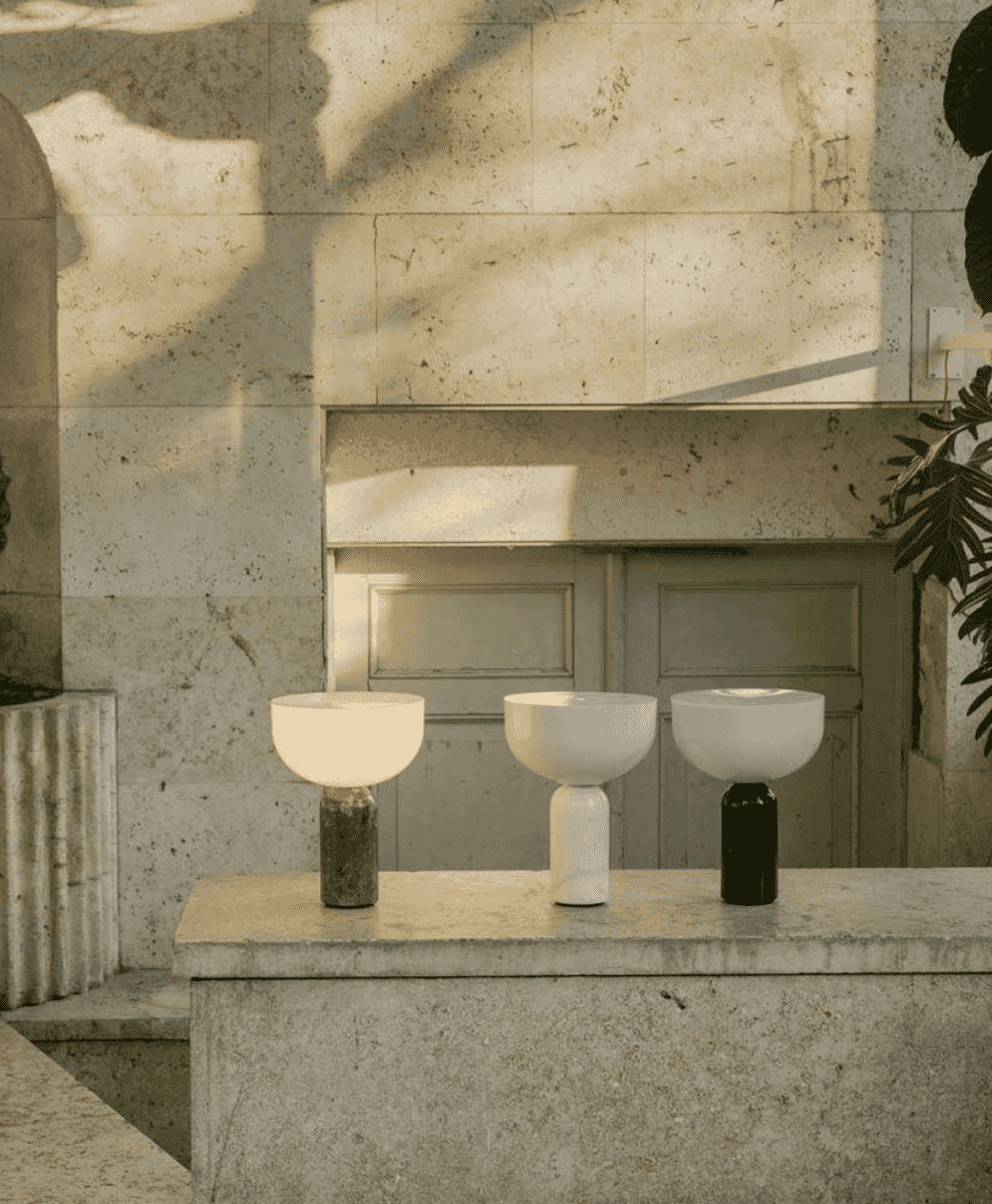 Three Kizu portable lamps with marble bases displayed on a matching surface.
