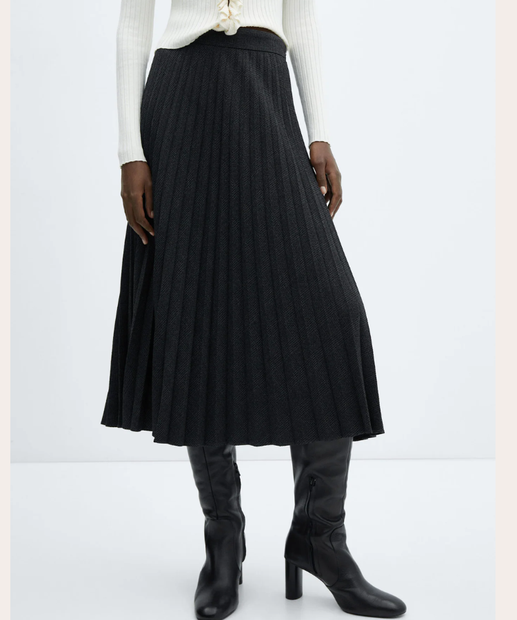A pleated midi skirt in a neutral tone.