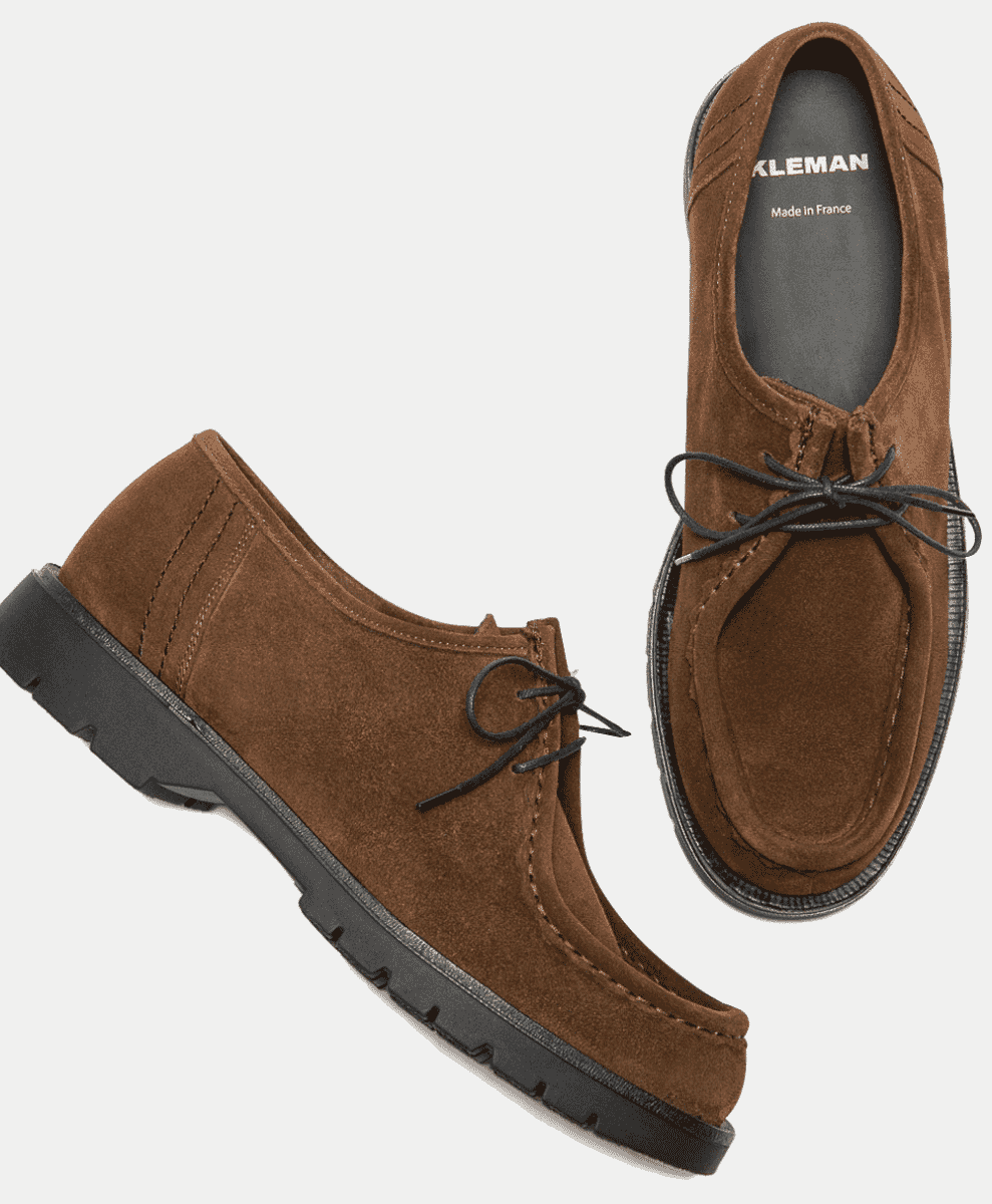 Pair of brown suede Kleman lace-up shoes with visible brand labeling.