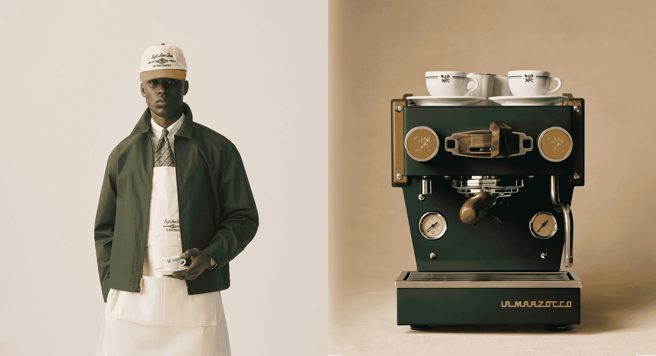 Full view of a model wearing the Aimé Leon Dore x La Marzocco uniform next to the collaborative espresso machine.