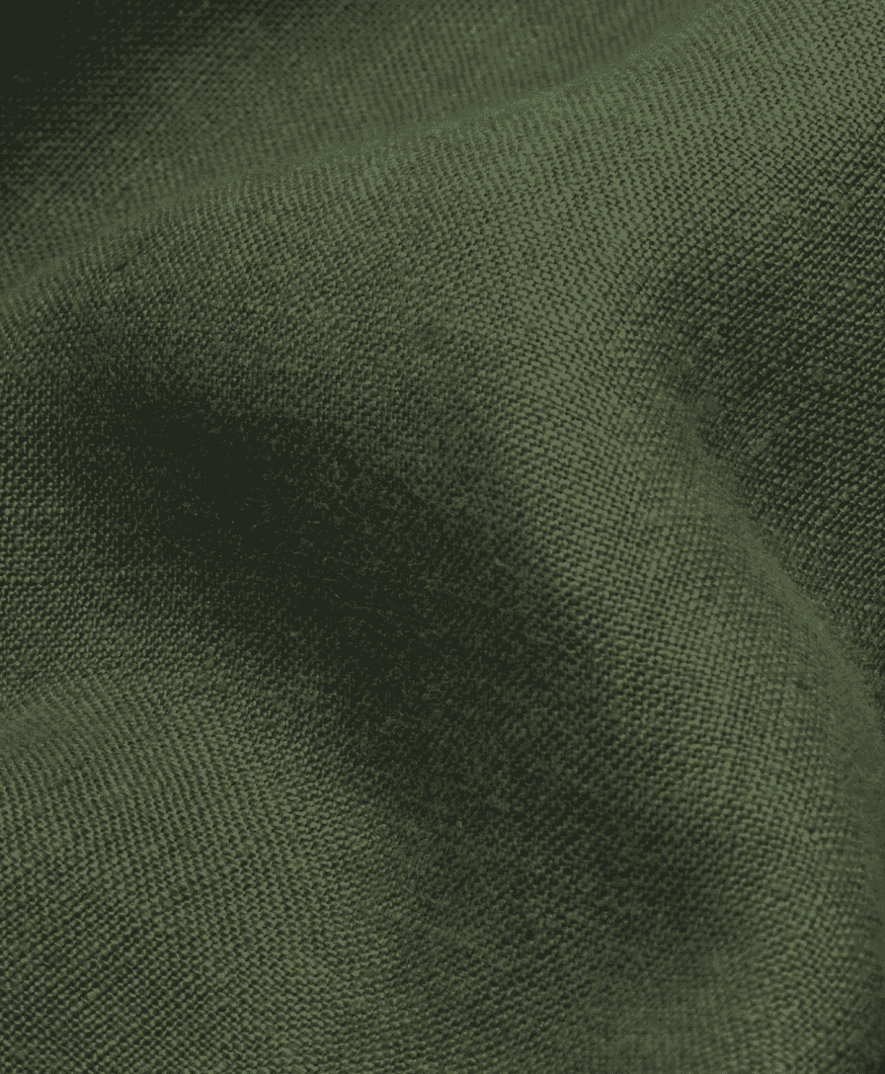 Close-up of olive green linen fabric showing the intricate weave and earthy tone.