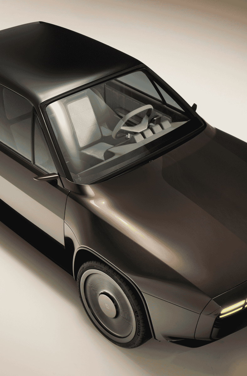 High-angle studio shot of the glossy dark R17 concept car showing its minimalist interior and exterior lines.