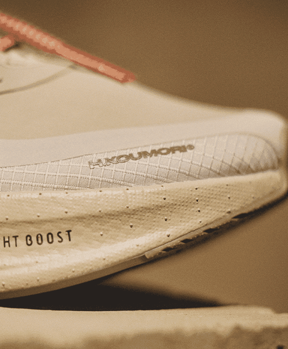 Close-up of the white midsole branding featuring H.KOUMORI text.