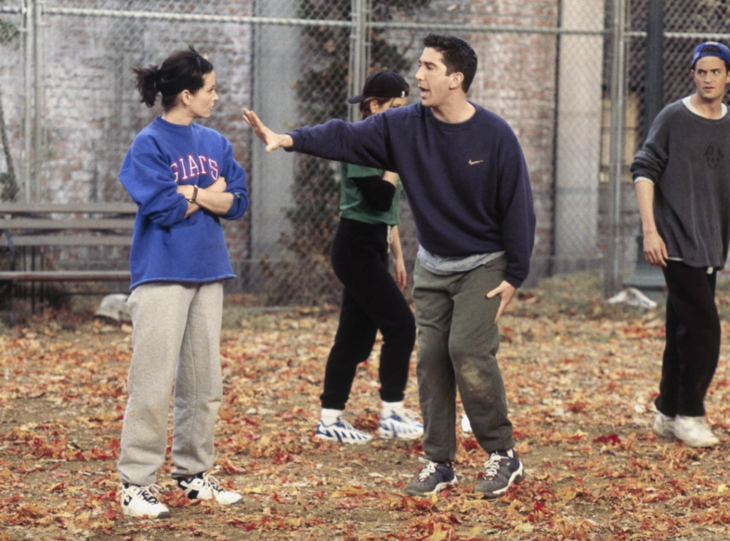 Monica Geller wearing a blue New York Giants graphic sweatshirt.