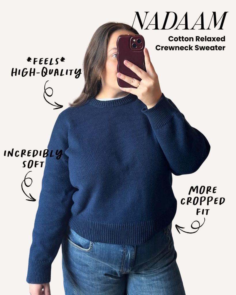 Lifestyle photo of a woman wearing a navy NAADAM cotton relaxed sweater.